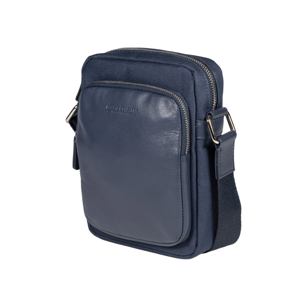 RB2002D | Nylon/Vera Leather Shoulder Bag, with light grain. Zipper closure and adjustable shoulder strap - Blue color - Size: 15.5 x 21 x 7 cm. Packaging: Non-Woven Fabric Bag